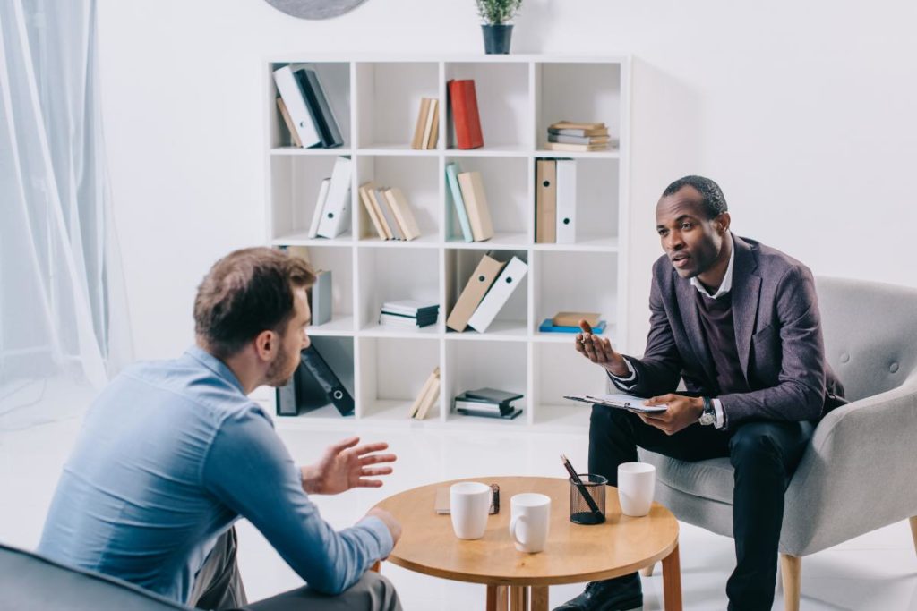 a man discusses an alcohol rehab in los angeles with a therapist