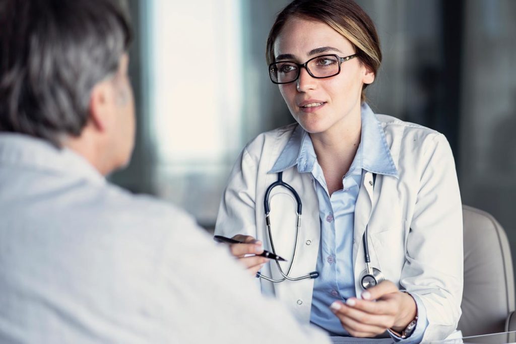 a person talks to a doctor possibly about side effects of benzos