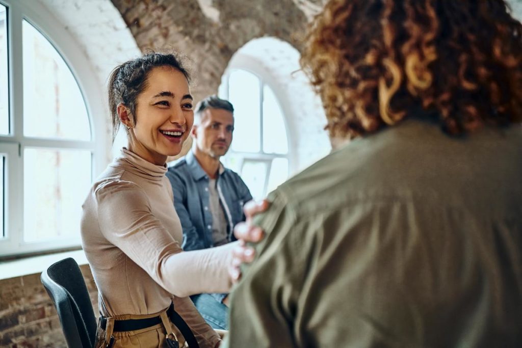 a group supports each other in a medical detox center