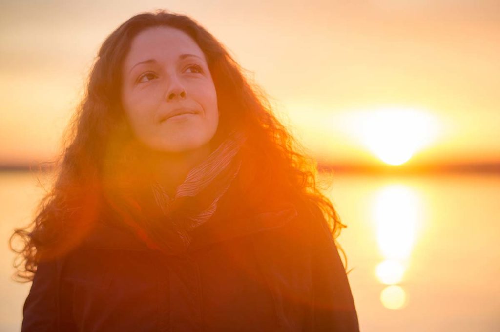 Woman enjoying sunlight outside on her way to a benzo detox center